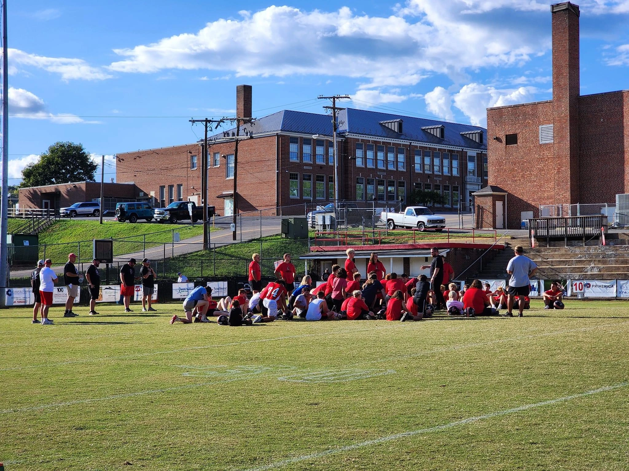 Football team huddle with coach